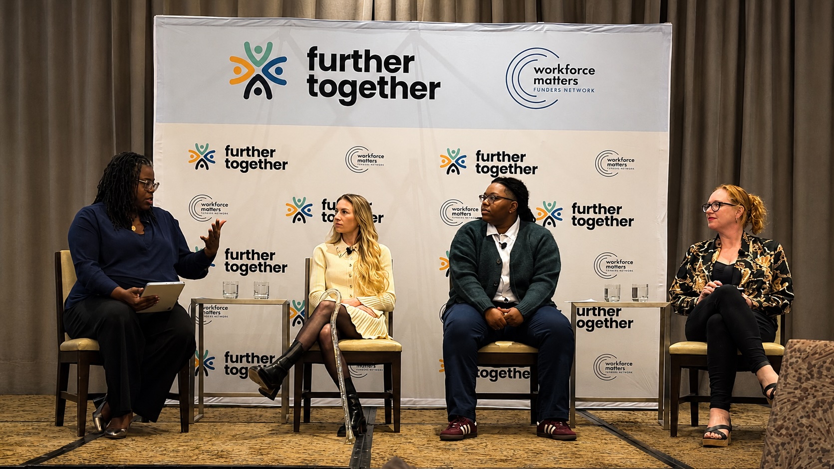Tameshia speaking on a panel